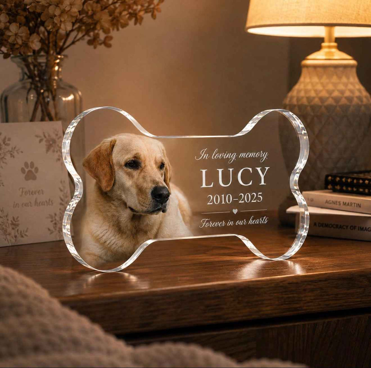 Personalized pet memorial bone plaque by Metal Sparx with engraved custom message and paw print design on metal surface.