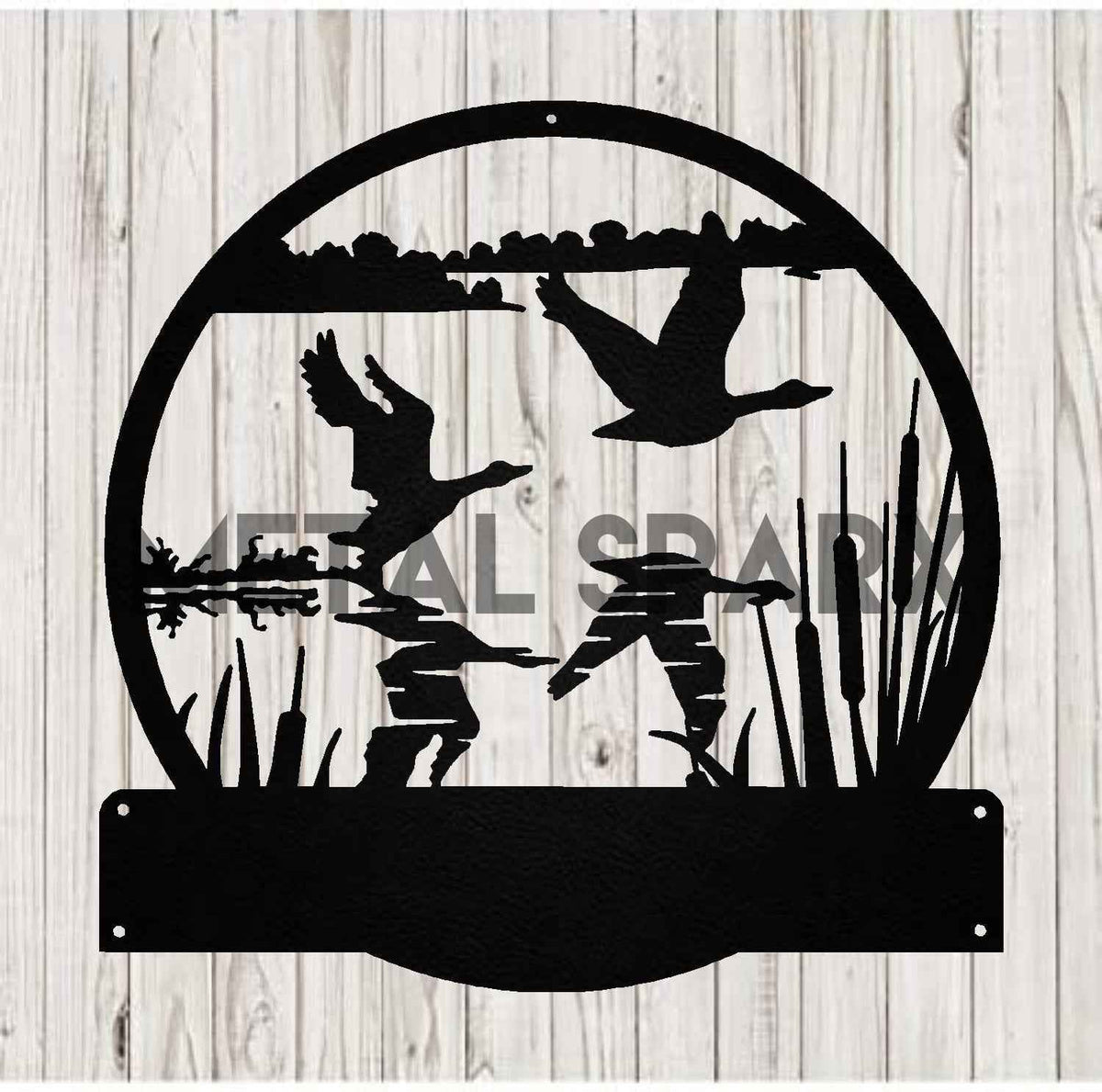 Black metal sculpture of geese taking flight by Metal Sparx, detailed bird figures in a dynamic flying formation.