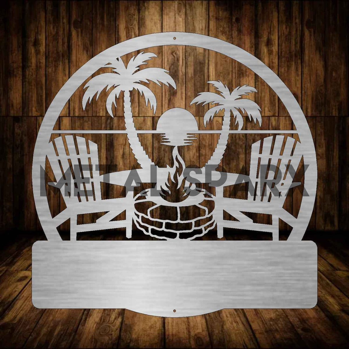 Metal Sparx beach fire pit with personalized monogram design, perfect for outdoor gatherings and beachside fires.