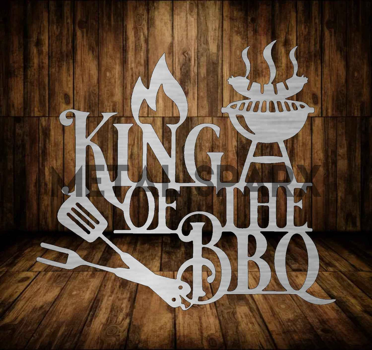 Metal Sparx King of the BBQ grilling tool with black handles and metal prongs for outdoor barbecue grilling.