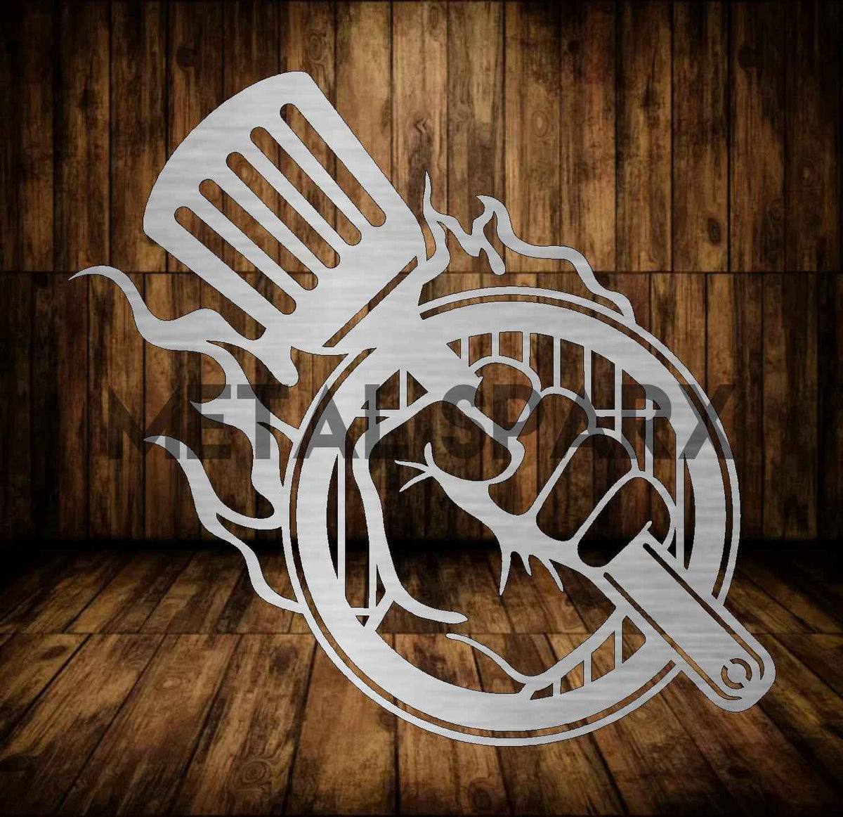 Metal Sparx grill hand tool with black handle, designed for safe handling and turning food on a barbecue grill.