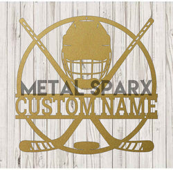 Gold Metal Sparx hockey puck with detailed branding and textured surface, designed for ice hockey games.