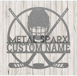 Silver Metal Sparx hockey stick with black accents, showcasing its sleek design and textured grip.