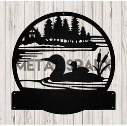 Black metal art of a loon with baby, featuring a monogram, by Metal Sparx, showcasing detailed, handcrafted nature-inspired design.