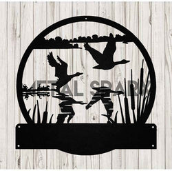 Black metal sculpture of geese taking flight by Metal Sparx, detailed bird figures in a dynamic flying formation.