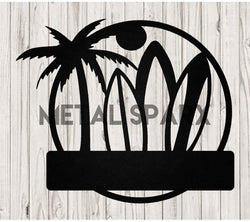 Black Metal Sparx surfboard lying on the sand, showcasing its sleek design and durable construction for riding waves.