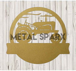Gold metal art featuring a vintage tractor monogram, crafted by Metal Sparx, with intricate details and a rustic finish.