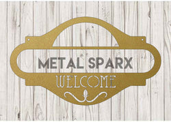 Gold welcome address sign by Metal Sparx with elegant lettering, perfect for greeting guests at home or events.