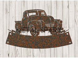 Rust-colored Metal Sparx pickup truck monogram metal art featuring a detailed truck silhouette on a rusted surface.