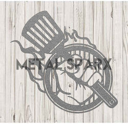 Silver Metal Sparx grill hand tool with a sturdy handle, designed for safe handling while barbecuing or grilling.