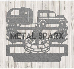 Silver metal art custom camping monogram by Metal Sparx displayed on a surface with intricate design details.