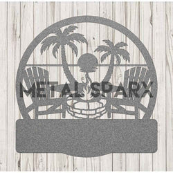 Silver Metal Sparx beach fire pit with monogram design, made of durable metal, perfect for outdoor gatherings and beach fires.