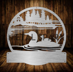 Metal Sparx metal art of a loon with baby monogram, featuring detailed bird design on a sleek metal finish.