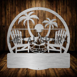 Metal Sparx beach fire pit with personalized monogram design, perfect for outdoor gatherings and beachside fires.