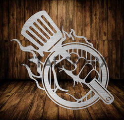 Metal Sparx grill hand tool with black handle, designed for safe handling and turning food on a barbecue grill.